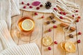 CupÃÂ ofÃÂ teaÃÂ withÃÂ lemonÃÂ onÃÂ aÃÂ woodenÃÂ tableÃÂ withÃÂ aÃÂ knittedÃÂ scarfÃÂ andÃÂ decorations